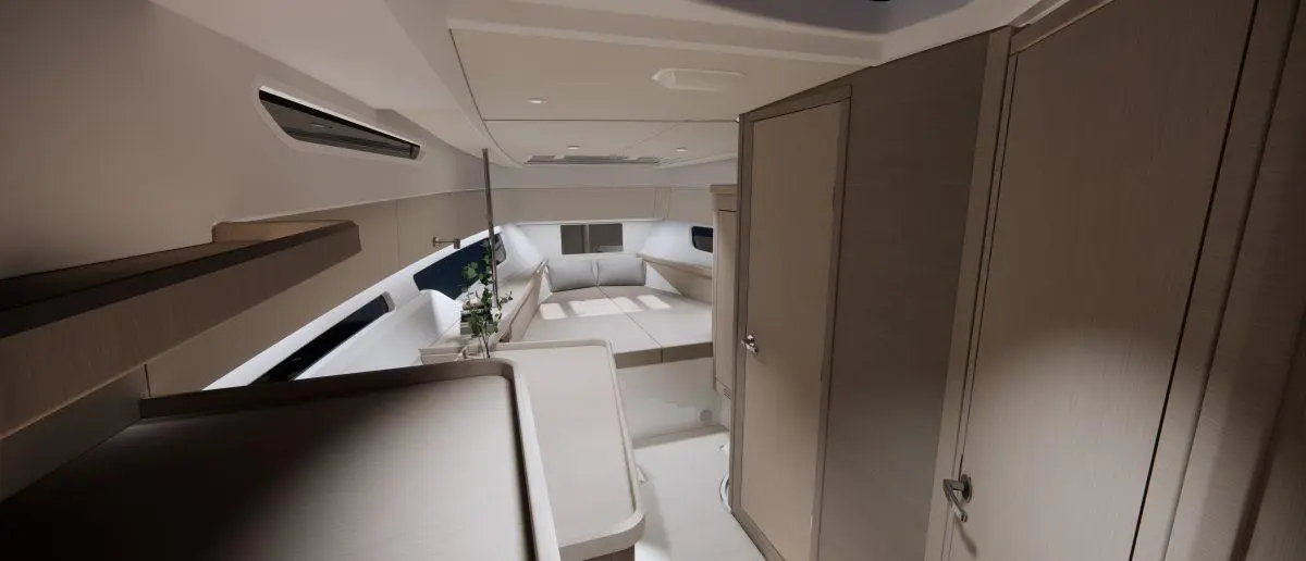 Modern interior of a yacht cabin featuring light wood finishes, seating area, and a small plant on a table.